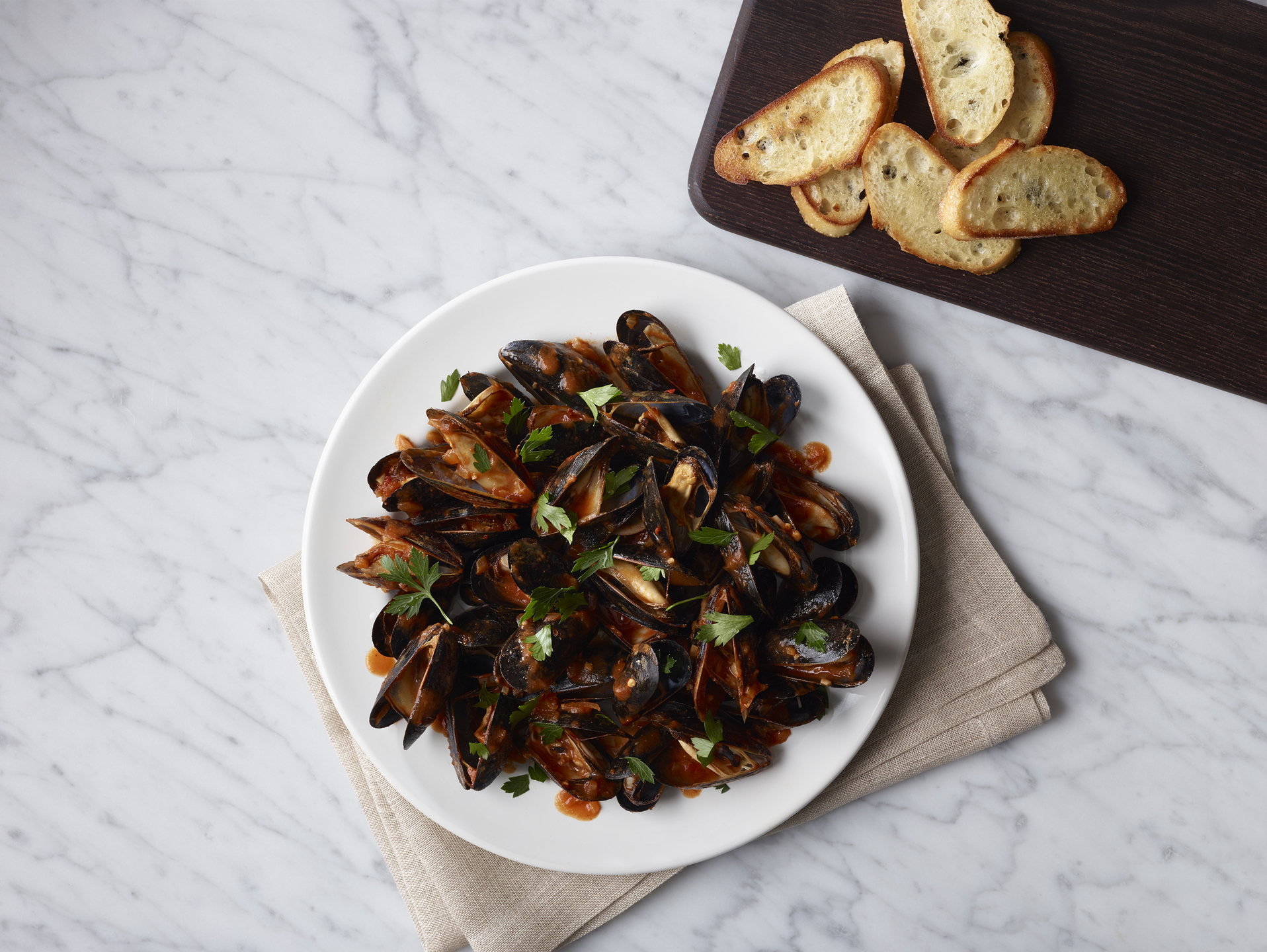 Mussels are on the menu inside the Polaris by United Business Class Lounge.