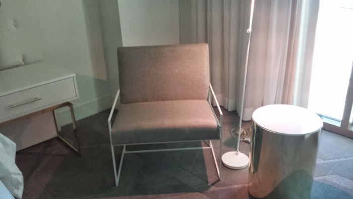 The bedroom has a reasonably comfortable chair. Something loungier with an ottoman might be nice but there's a big couch in the next room for that kind of thing. Chair in bedroom.