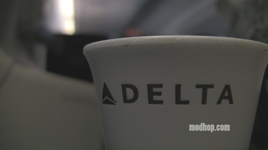close up of a white cup with black text
