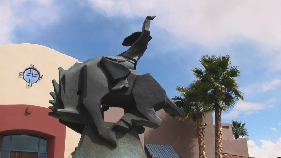 Cowboy riding bull statue outside Lodge on the Desert in Tucson