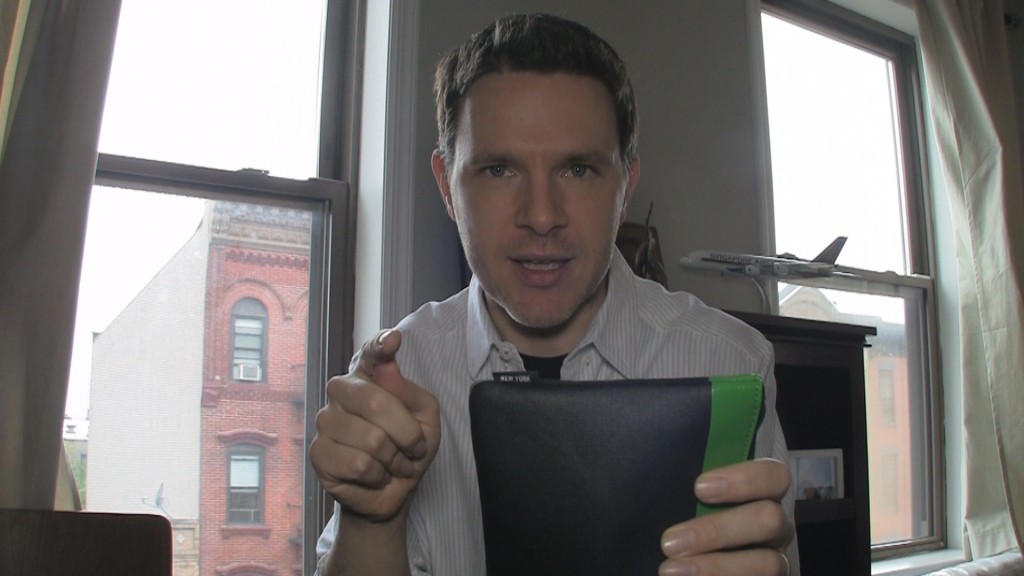 a man holding a tablet and pointing