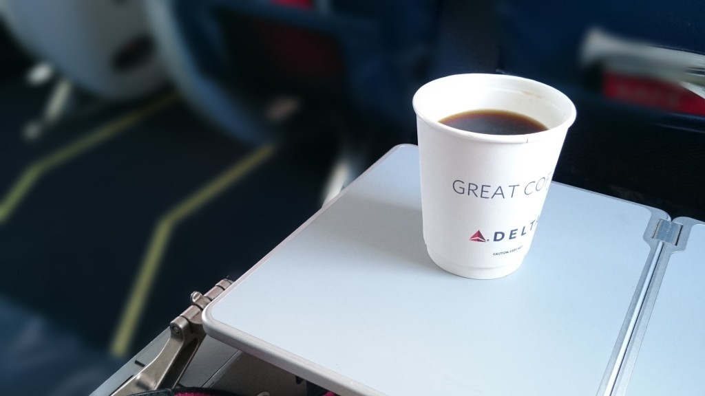 Delta Comfort Plus in row 5 with tray extended...and coffee.