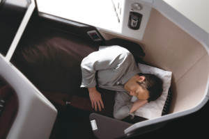 a man sleeping on a plane