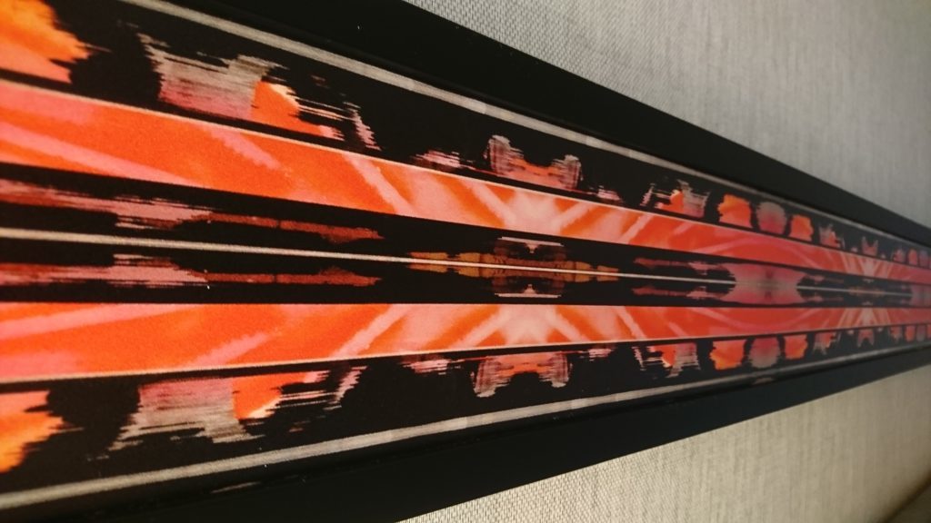 a picture frame with orange and black stripes