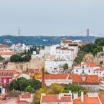 a group of buildings with red roofs