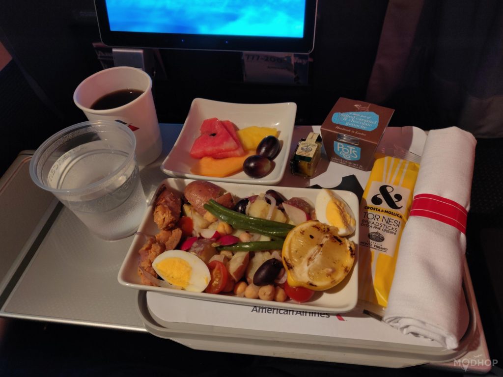 a tray of food and a drink on a table