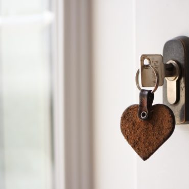 a key with a heart shaped keyring