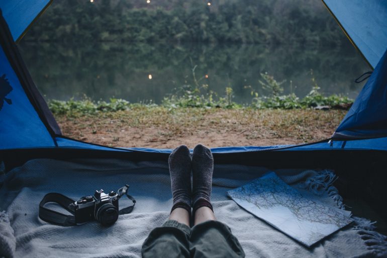 People camping by the river