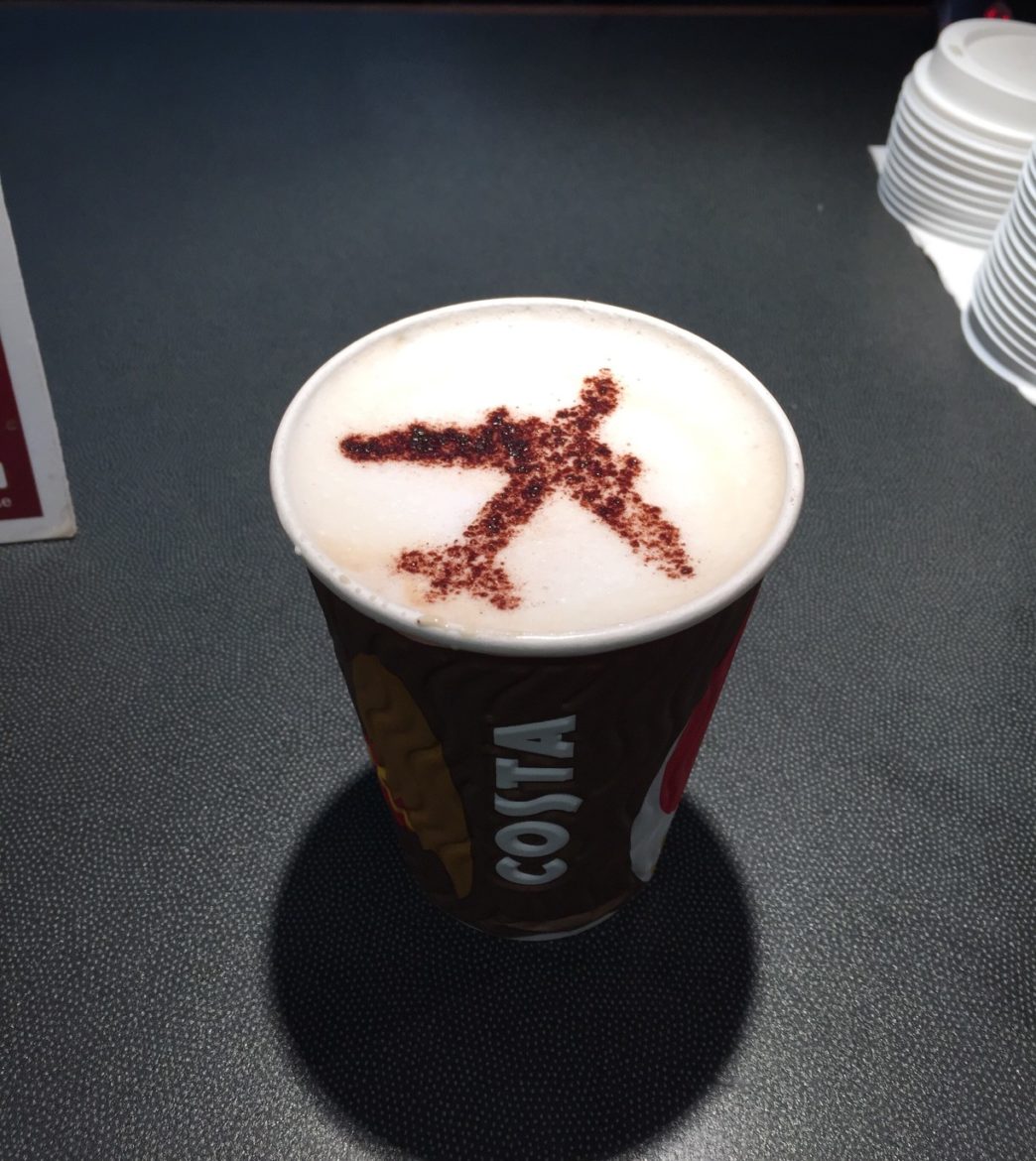 a cup of coffee with a red x on top