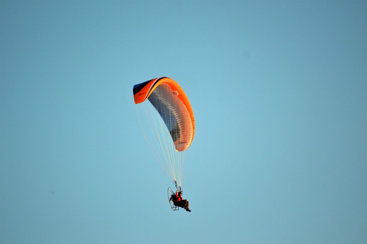 paragliding a pop of color orange