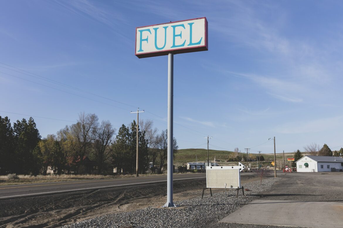 Fuel sign for rural gas station in a small town.