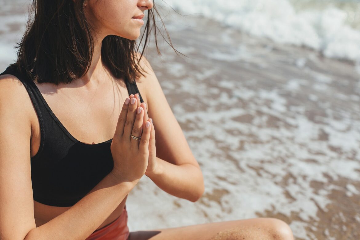 Yoga and meditation on beach.