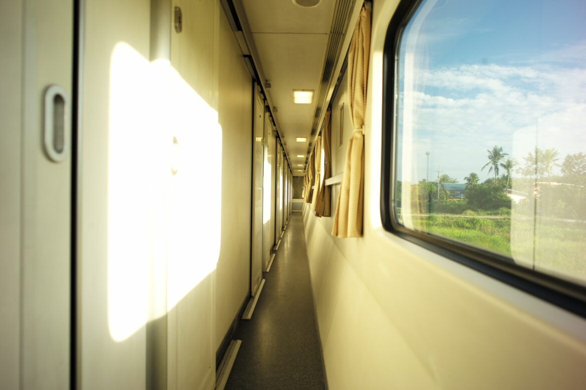 a long hallway with windows and curtains