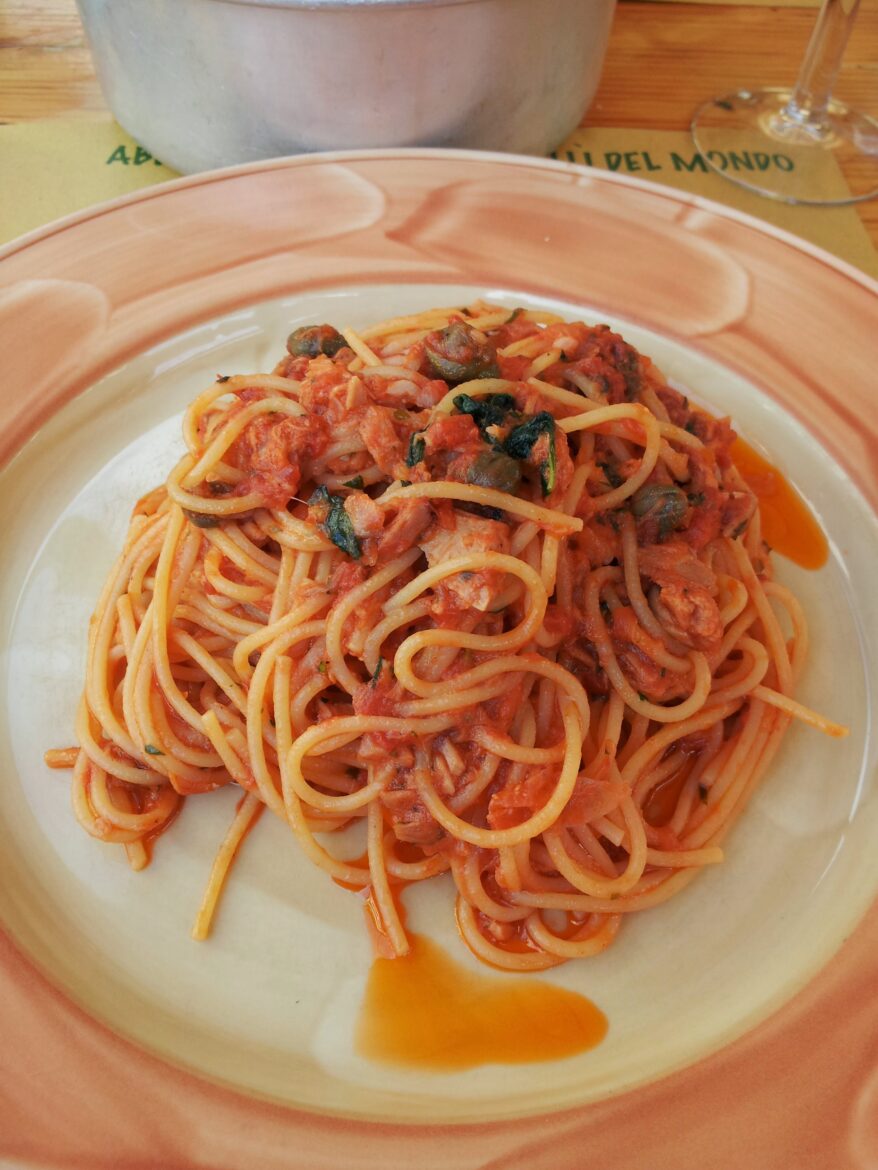 a plate of tuna spaghetti with sauce