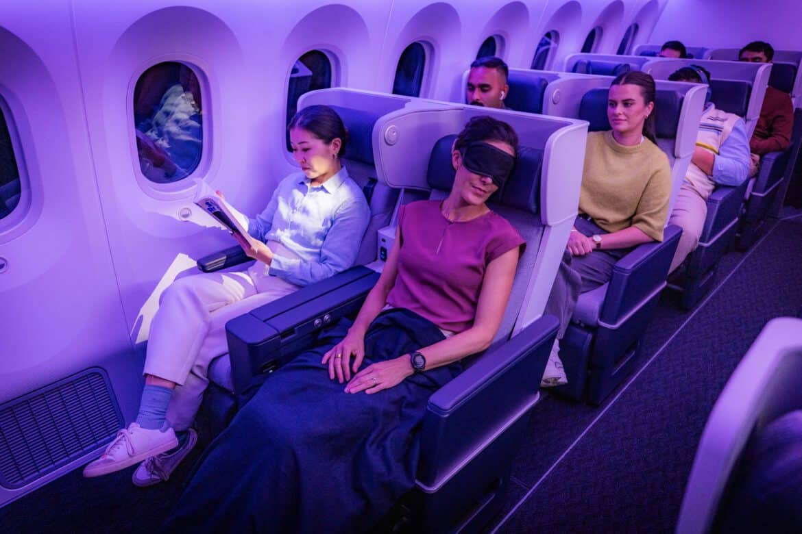 Passnegers sleeping in premium economy seats wondering "Is Air New Zealand skynest worth it?"
