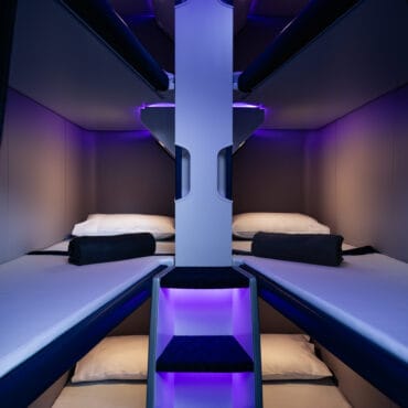 view of neon soaked sleep beds on-board making air new zealand skynest worth it for the long-haul.
