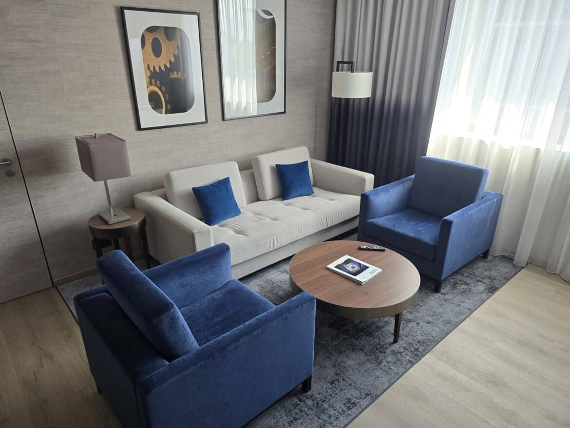 Couch and chairs inside Marriott Geneva suite.