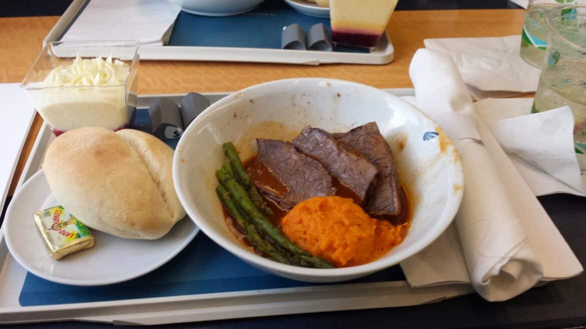 Sloppily plated but edible beef and vegetable plate in acela first class.
