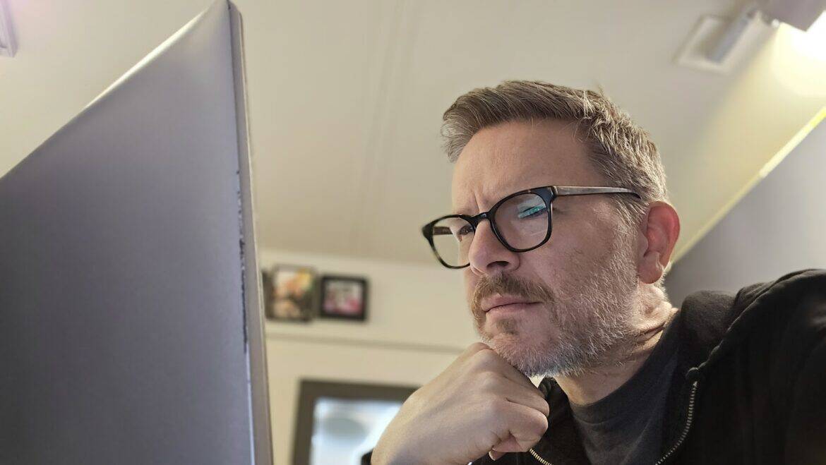 don't fall for hidden airline fees. Jake looks at his laptop