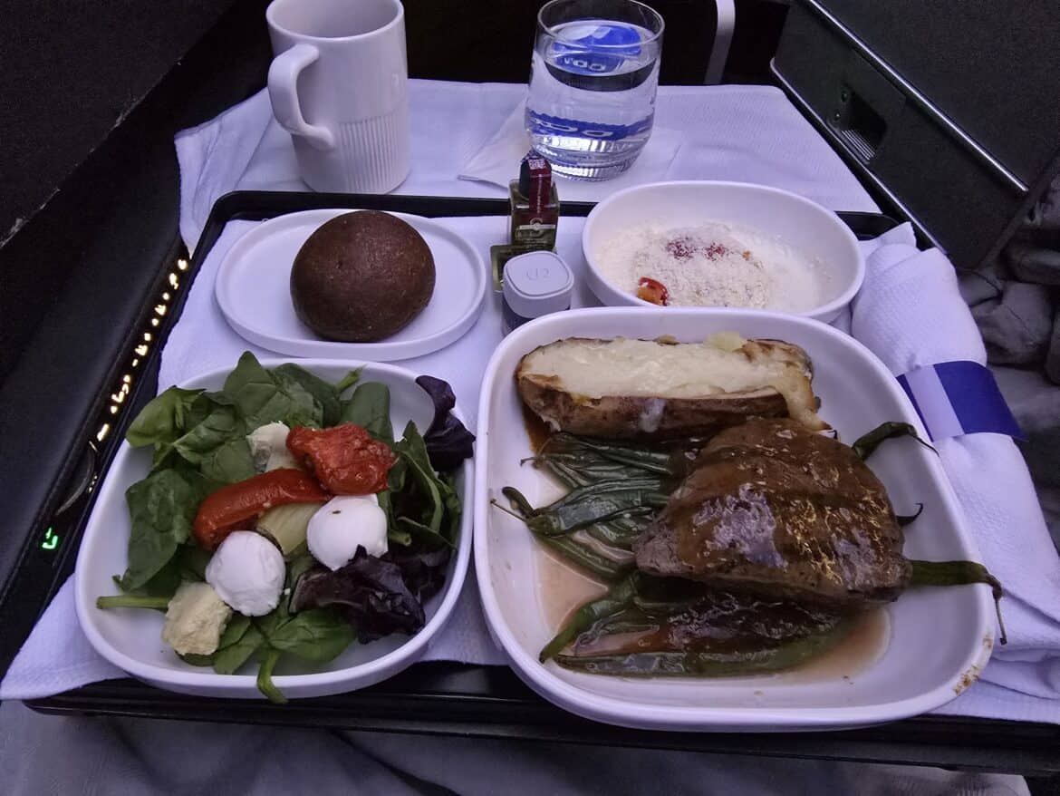 Is business class worth it on a 6-hour flight? Sure, served with meat, potatoes, salad and a sundae bar (not shown).