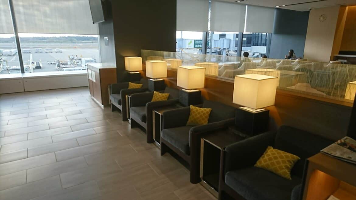 A dimly lit corner with seating during your first airport lounge visit