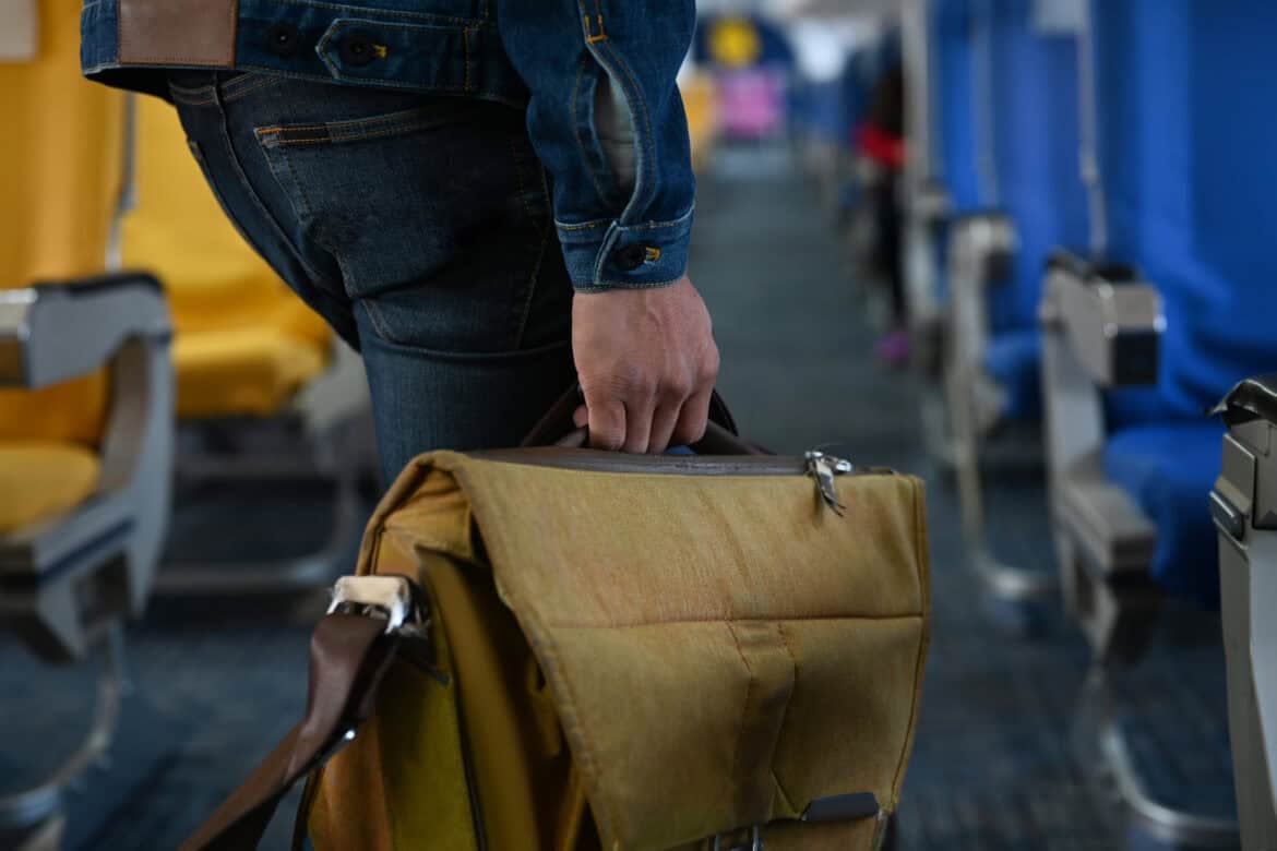 Man with backpack boarding early.